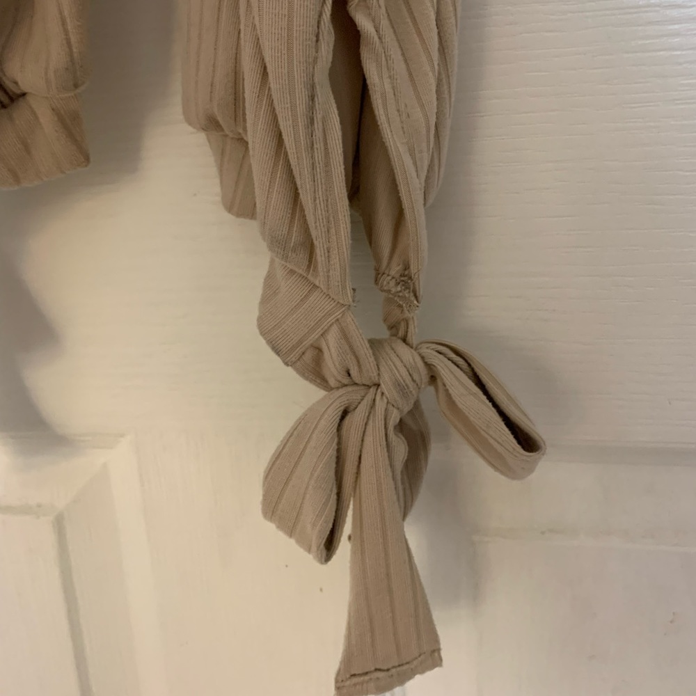 Super cute beige jump suit with tie ankles
